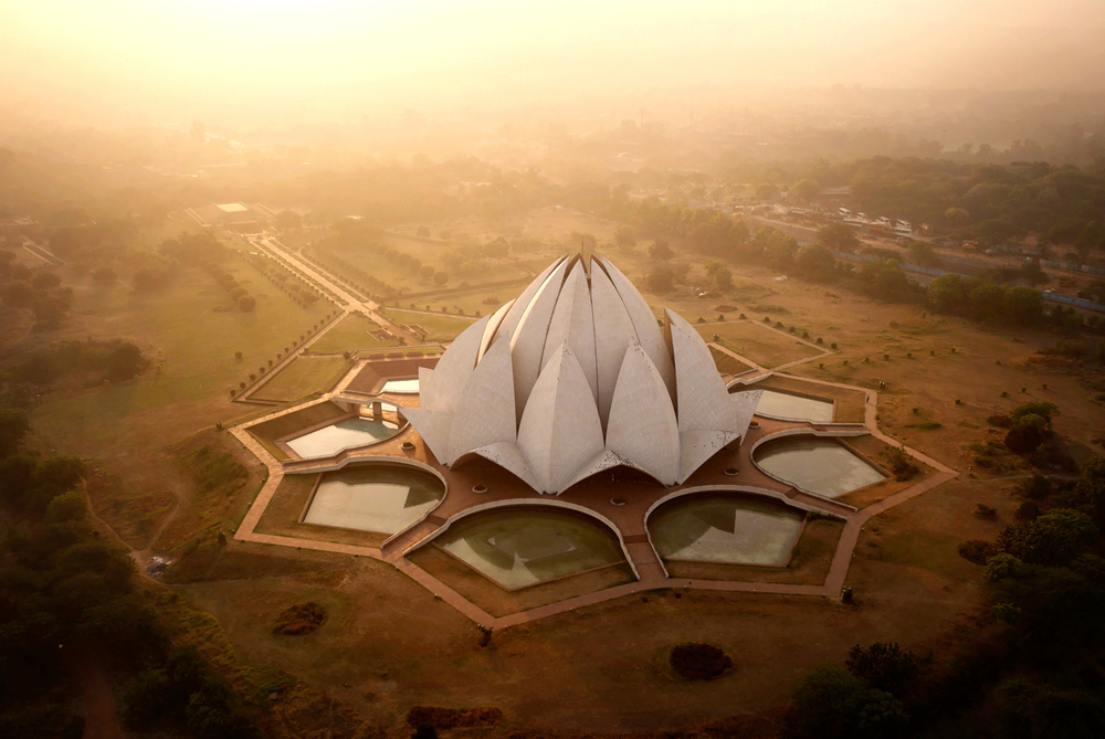 The Lotus Temple, dotted with pigeons at sunrise. Designed by an Iranian exile, the building serves as the centre of the Bahai'i faith in Delhi.
